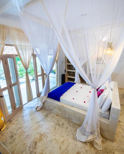 Ένα ή περισσότερα κρεβάτια σε δωμάτιο στο Sharazad Oasis Retreat