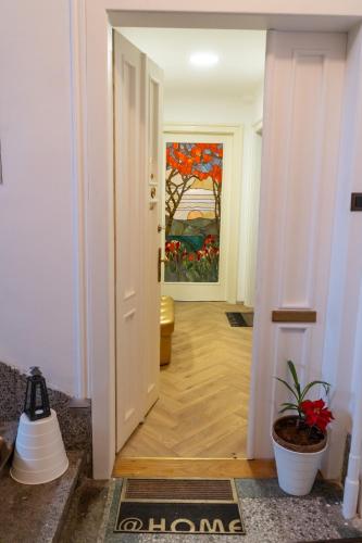 a hallway with a painting on the wall at GOLDIE in Zagreb