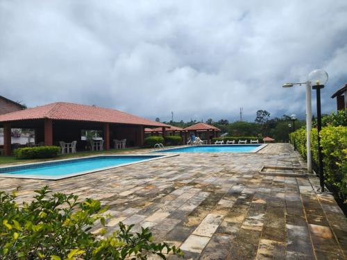 a view of the swimming pool at the resort at Chalé em Gravatá in Gravatá