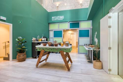 a room with a table with food on it at LATROUPE Grand Place Hostel in Brussels