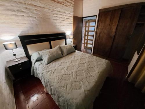 Una cama o camas en una habitación de PORTAL ANDINO
