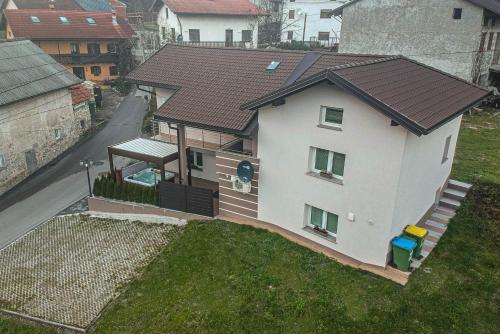 an aerial view of a house with a roof at Hiša Bohinc z wellnessom in Tolmin