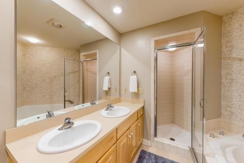 a bathroom with two sinks and a shower at Solitude Village H103 in Ludlow