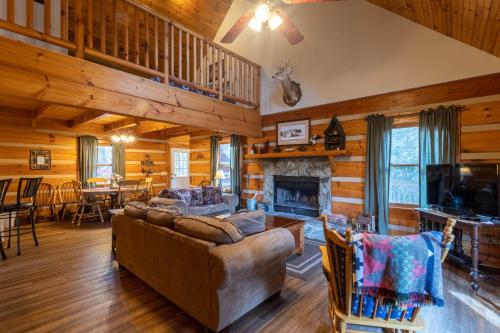 a living room with a couch and a fireplace at River Ridge in Boone