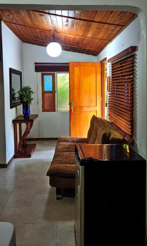 a living room with a couch and a table at Playa Mar Sun Caribe in Turbo