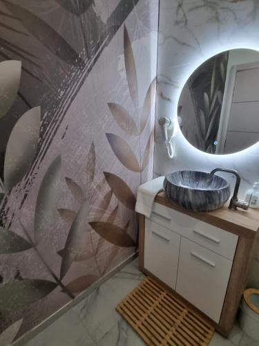 a bathroom with a sink and a mirror at Plaza La - Night and Spa in Sremska Mitrovica