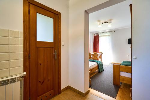 a room with a door leading to a bedroom at Goga in Zakopane