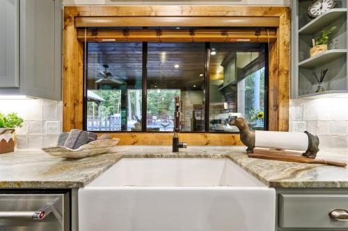 a kitchen with a sink with a faucet at Lazy Dog in Stephens Gap