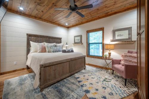 a bedroom with a bed and a ceiling fan at Lazy Dog in Stephens Gap