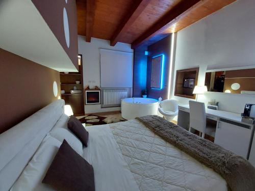 a large bedroom with a large bed and a bathroom at Del Cavaliere in Castrovillari