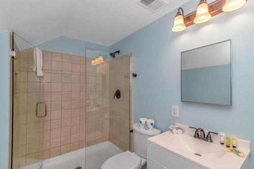 a bathroom with a shower and a toilet and a sink at 125 Atlantic Avenue Unit G2 -Pet Friendly! Loft Apartment -Sleeps 2-4 guests! in Myrtle Beach