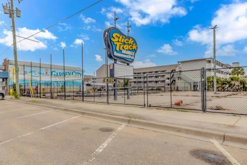 an empty parking lot with a sign for a snack truck at 125 Atlantic Avenue Unit G2 -Pet Friendly! Loft Apartment -Sleeps 2-4 guests! in Myrtle Beach
