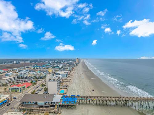 a view of the beach with a pier at 125 Atlantic Avenue Unit G2 -Pet Friendly! Loft Apartment -Sleeps 2-4 guests! in Myrtle Beach
