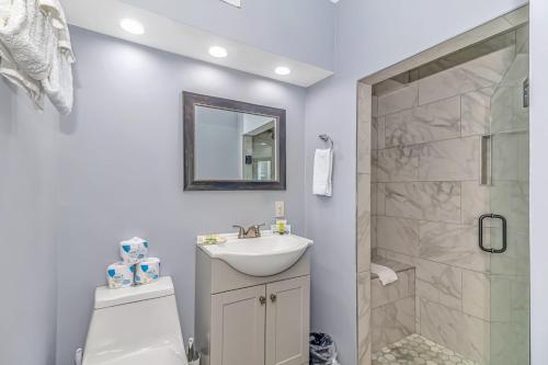a bathroom with a sink and a shower at 125 Atlantic Avenue Unit K - Pet Friendly! Walk To The Beach and Pier! 1BR - 1BA -Sleeps 2-4 guests! in Myrtle Beach