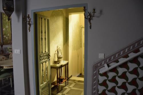 an open door to a room with a table at Casa Xanadu Seville - Boutique rooms with terraces in Seville