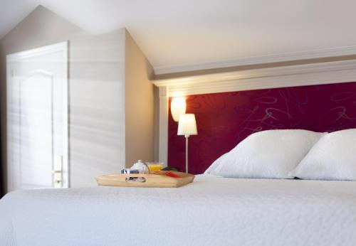Ένα ή περισσότερα κρεβάτια σε δωμάτιο στο Hotel Plaza Cavana