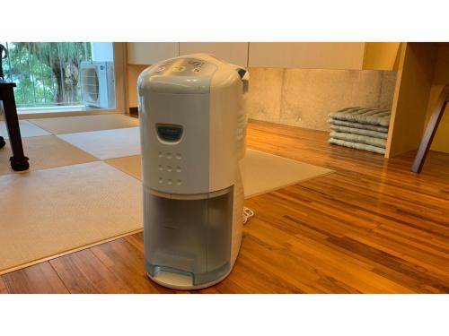 a heater is sitting on the floor in a room at On the Beach Lue - Vacation STAY 91578v in Sesoko