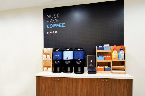 a counter with bottles of coffee on it at Holiday Inn Express & Suites Frazier Park by IHG in Lebec