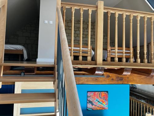 a set of stairs in a room with a crib at La Bonne Note in Chinon