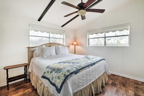 a bedroom with a bed with a ceiling fan at Carmine Cottage with Porch on Beautiful 60-Acre Farm in Carmine