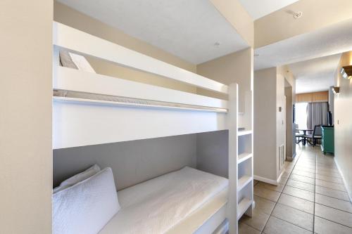 a room with two bunk beds with a hallway at Windemere 904 Pool Side Cabana Included! in Perdido Key