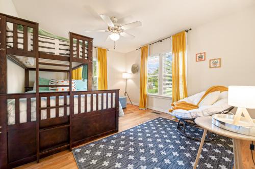 a bedroom with a bunk bed and a table at The Little Rock House in Bentonville