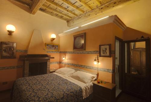En eller flere senger på et rom på Soggiorno La Pergola