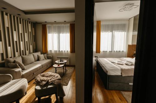 Кровать или кровати в номере Apartmani Leo Titova Vila Zlatibor