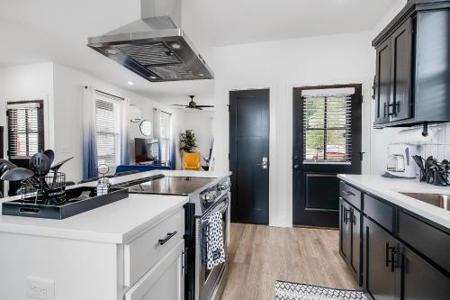 a kitchen with a sink and a stove top oven at The Hub in Fayetteville