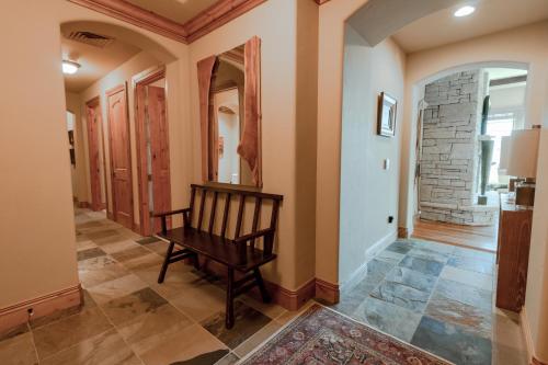 a hallway with a rocking chair in a house at Silver Strike Condo by Park City Vacations in Park City