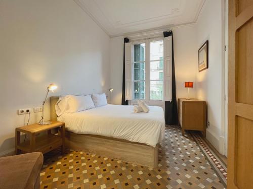 A bed or beds in a room at Stay Unique Apartments Bruc