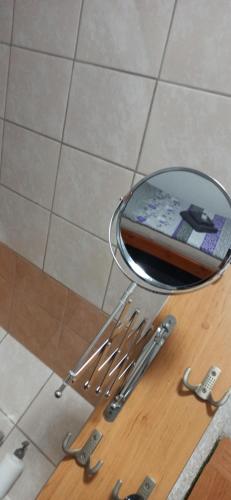 a group of knives sitting on a table next to a mirror at Penzion Forest in Rozvadov