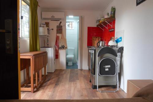 Kuchyň nebo kuchyňský kout v ubytování Cabaña en Punta del Diablo 001