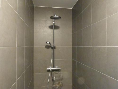 a shower with a shower head in a bathroom at Appartement 2-6 pers, 2 ch, balcon, piscine, accès plage, parking - FR-1-194-234 in La Tranche-sur-Mer