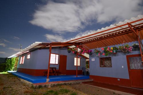 a house with a red white and blue at Casa Angelita in Nuevo Colón