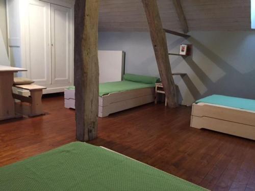 a room with two bunk beds and a staircase at Gîte Berfay, 5 pièces, 11 personnes - FR-1-410-157 in Berfay