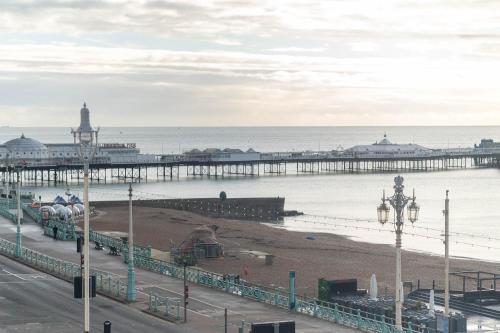 a view of a pier with a beach and the ocean at Sealanes 1 in Brighton & Hove