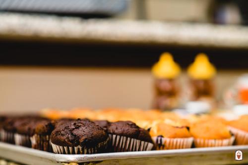 a tray of chocolate muffins on a table at Coyote South in Santa Fe