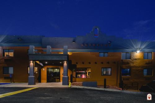 a building with a parking lot in front of it at Coyote South in Santa Fe