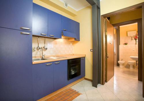 A kitchen or kitchenette at Argentiere Room Apartments