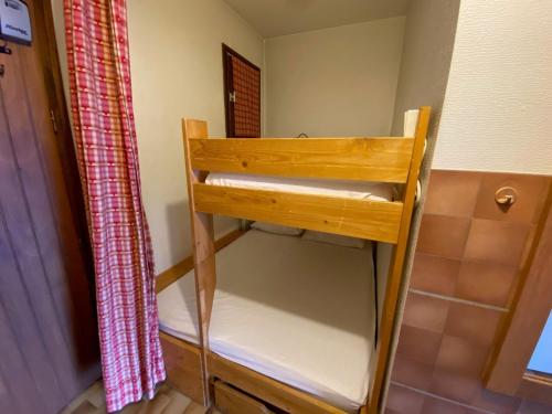 a wooden shelf in a bathroom with a shower curtain at Charmant Studio Cabine proche des Pistes, Village et Commerces - Location Idéale La Clusaz - FR-1-459-200 in La Clusaz