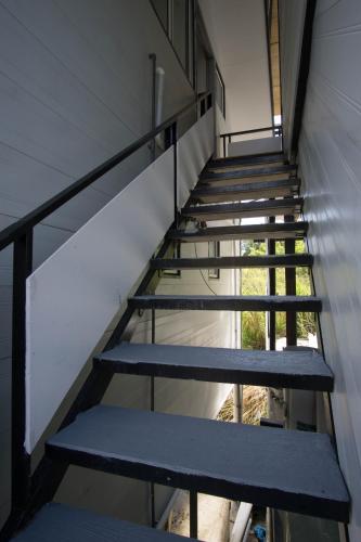 a set of stairs in a building at Amazing Grace Lodge in Kundasang