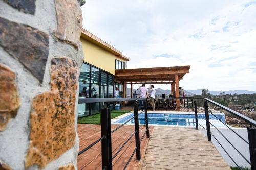 a view from the deck of a house with a pool at Casa Brisa in Chivato