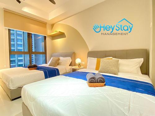 Katil atau katil-katil dalam bilik di Bali Residence Melaka By Heystay Management