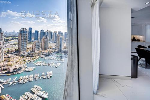 a room with a view of a harbor with boats at Cayan Tower, Dubai Marina in Dubai