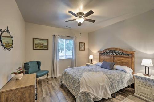 a bedroom with a bed and a ceiling fan at Bleu Hill Cottage Ski Snow Bowl and Hike Flagstaff! in Flagstaff