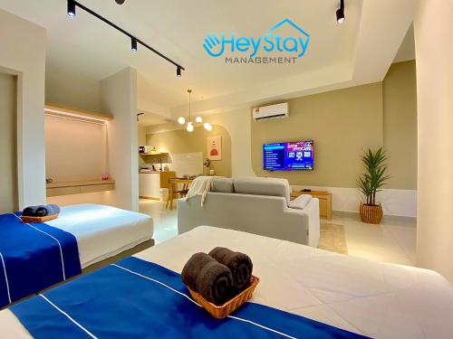 Katil atau katil-katil dalam bilik di Bali Residence Melaka By Heystay Management