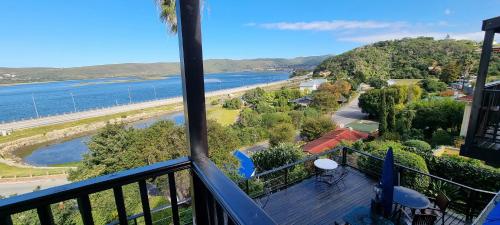 a balcony with a view of the water at Lagoon Lodge in Knysna