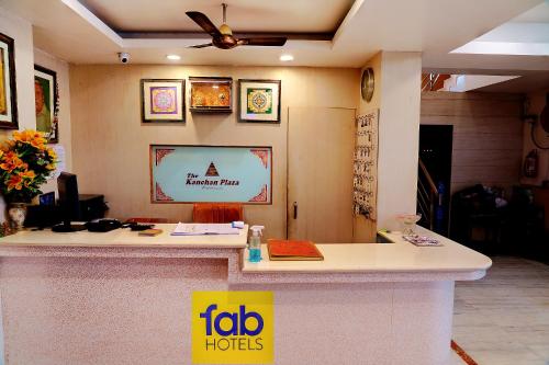 a lobby of a hotel with a reception counter at FabHotel Kanchan Plaza in Bhubaneshwar
