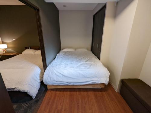 Posteľ alebo postele v izbe v ubytovaní Amber Iidabashi